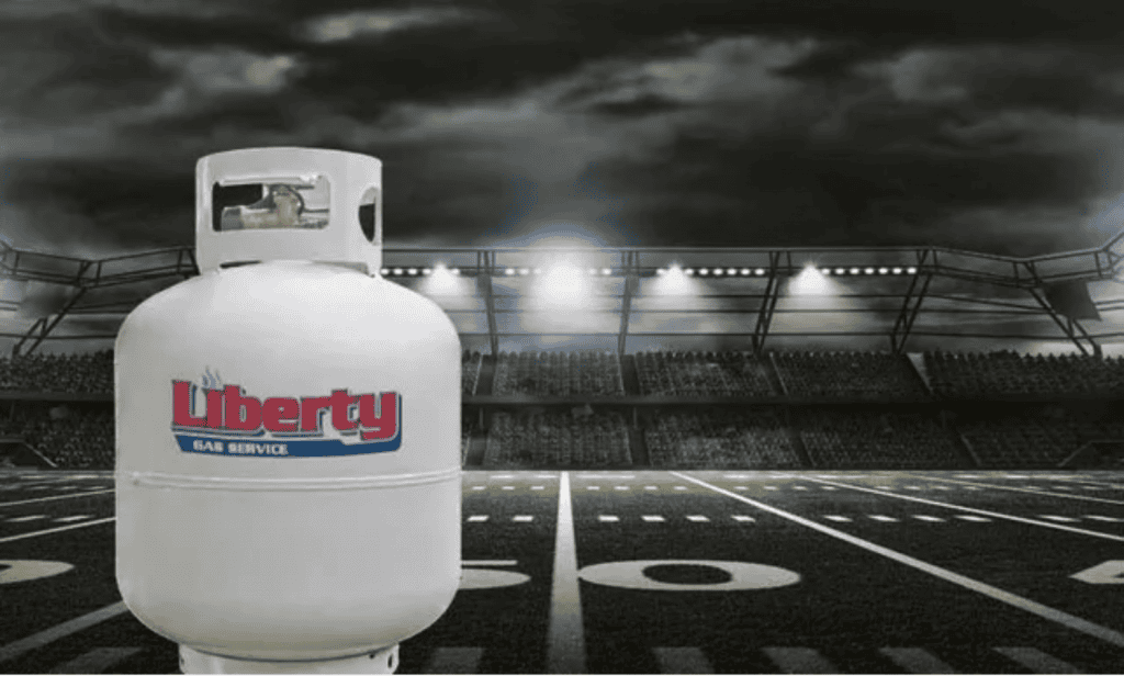 propane tank and football field graphic with liberty gas logo.