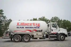 Fuel tanker truck parked in Suffolk County, New York, with Liberty Gas Service branding visible, ready to deliver essential fuel services to local homes and businesses